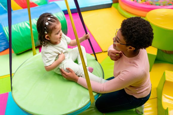 Staff with child in clinic